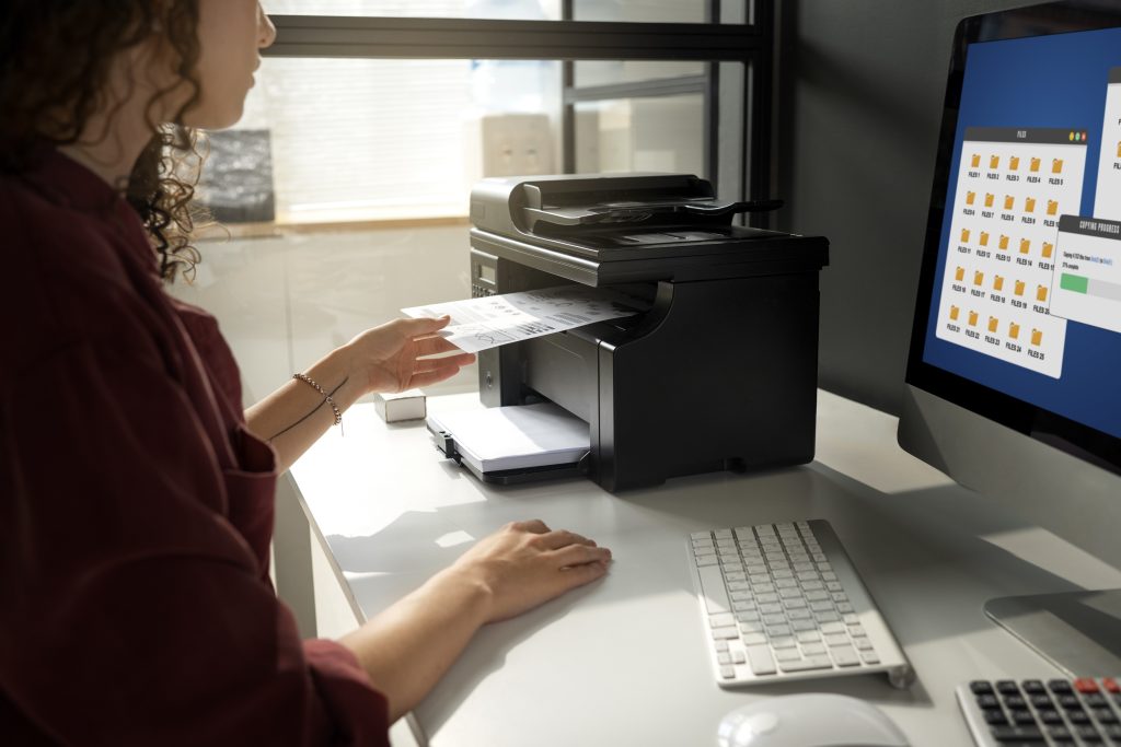 side-view-woman-working-with-printer